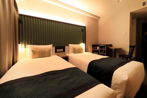 Habitación Doble Superior de 17 m² con vistas al parque - 2 camas - No fumadores del hotel The Knot Tokyo Shinjuku. Foto 10