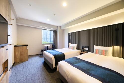 Habitación Doble Deluxe de 20 m² con vistas al parque - 2 camas - No fumadores del hotel The Knot Tokyo Shinjuku. Foto 4