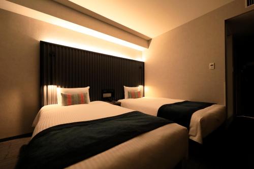 Habitación Doble Deluxe de 20 m² con vistas al parque - 2 camas - No fumadores del hotel The Knot Tokyo Shinjuku. Foto 6