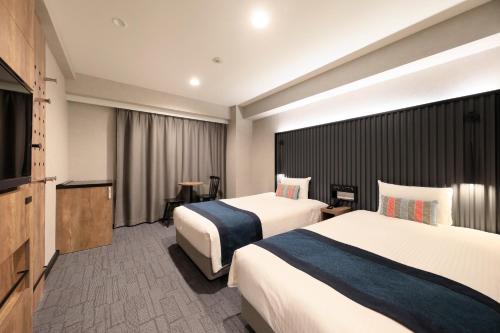 Habitación Doble Deluxe de 20 m² con vistas al parque - 2 camas - No fumadores del hotel The Knot Tokyo Shinjuku. Foto 11