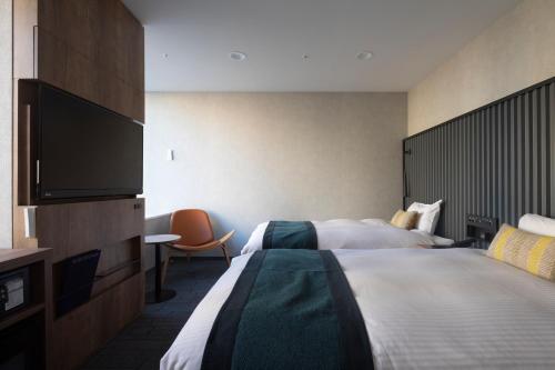 Habitación Doble Deluxe Extragrande de 30 m² - 2 camas - Planta superior - No fumadores del hotel The Knot Tokyo Shinjuku. Foto 2