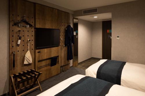 Habitación Doble Deluxe de 20 m² - 2 camas - No fumadores del hotel The Knot Tokyo Shinjuku. Foto 1