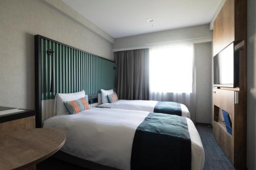 Habitación Doble Superior de 17 m² con vistas al parque - 2 camas - No fumadores del hotel The Knot Tokyo Shinjuku. Foto 1