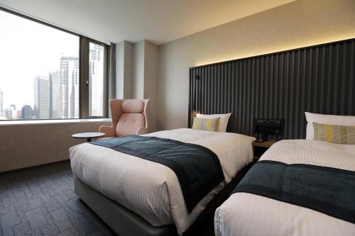 Habitación Doble Deluxe de 23 m² con vistas al parque - 2 camas - Planta superior - No fumadores del hotel The Knot Tokyo Shinjuku. Foto 1