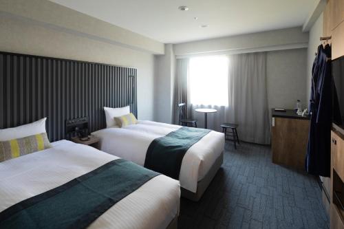 Habitación Doble Deluxe de 20 m² con vistas al parque - 2 camas - No fumadores del hotel The Knot Tokyo Shinjuku. Foto 1