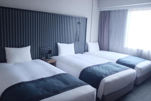 Habitación Triple Deluxe de 20 m² - Planta superior - No fumadores del hotel The Knot Tokyo Shinjuku