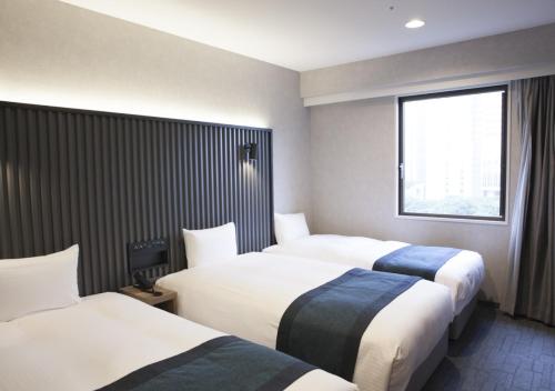 Habitación Triple Deluxe de 20 m² con vistas al parque - No fumadores del hotel The Knot Tokyo Shinjuku