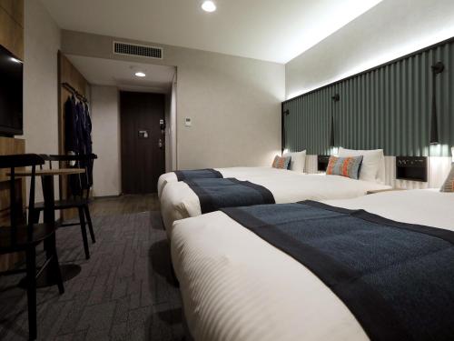 Habitación Triple Deluxe de 21 m² - No fumadores del hotel The Knot Tokyo Shinjuku