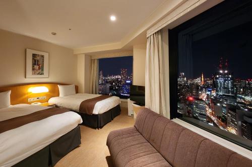 Habitación Doble Esquinera con sofá - 2 camas - Plantas 19 - 27 de la Torre principal - No fumadores del hotel Shinagawa Prince. Foto 1
