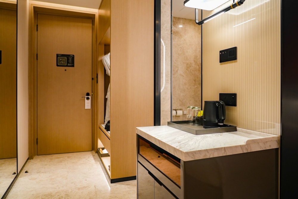 HABITACION EJECUTIVA con una Cama King Size del hotel Grand Mercure Yichang Waitan. Foto 1