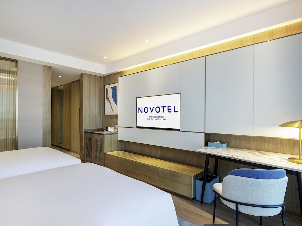 Habitación superior con 2 camas individuales del hotel Novotel Suzhou Huanxiu Lake. Foto 3