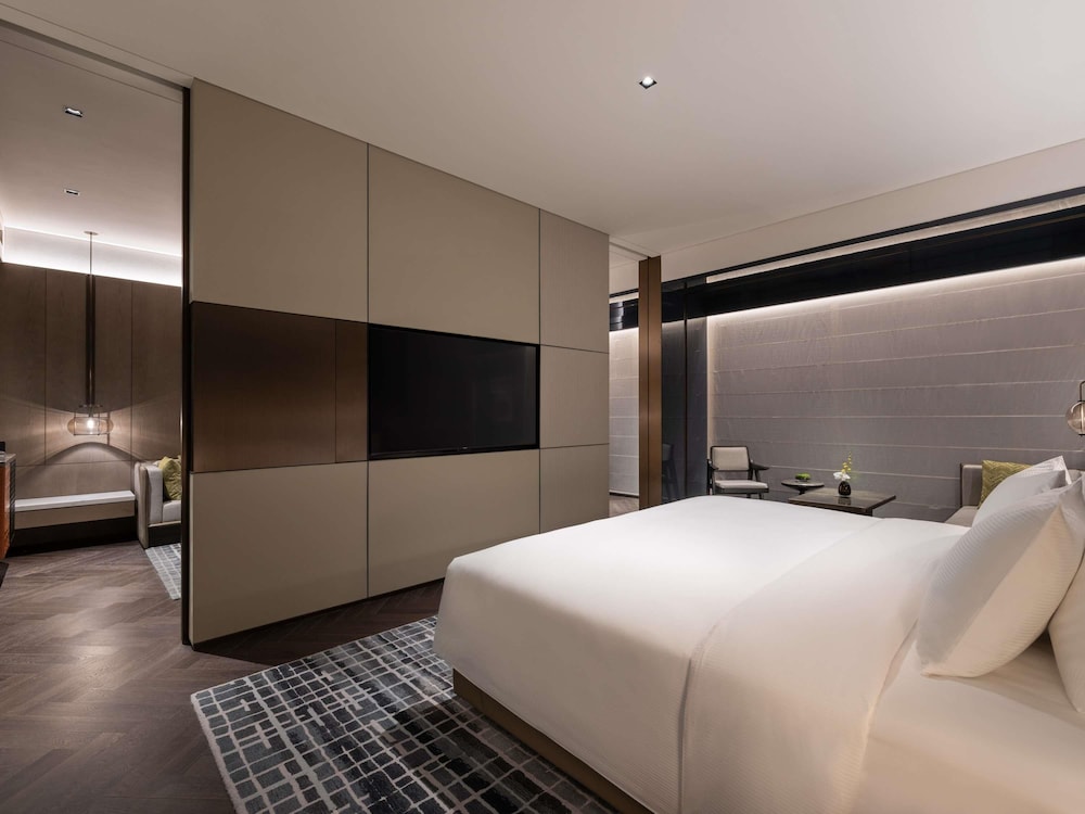 Suite Deluxe, Una Cama King Size, Vistas a la Ciudad del hotel Pullman Quanzhou Shuitou. Foto 2