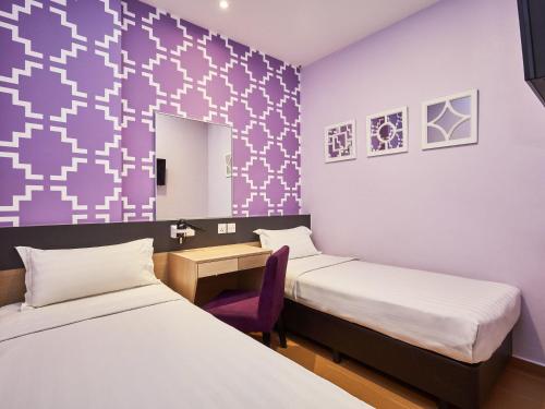 Habitación estándar con 2 camas individuales del hotel Ibis Budget Singapore Joo Chiat (sg Clean). Foto 1