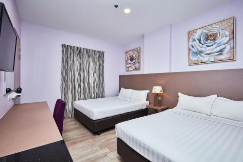 Habitación Superior con 2 camas dobles del hotel Ibis Budget Singapore Joo Chiat (sg Clean). Foto 1