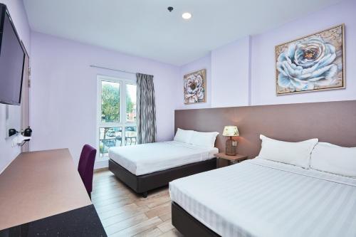 Habitación Superior con 2 camas dobles del hotel Ibis Budget Singapore Joo Chiat (sg Clean). Foto 2