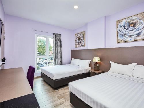 Habitación Superior con 2 camas dobles del hotel Ibis Budget Singapore Joo Chiat (sg Clean). Foto 2