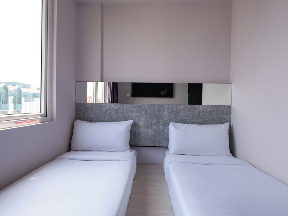 Habitación Deluxe con 2 camas individuales del hotel Ibis Budget Singapore Pearl (sg Clean)