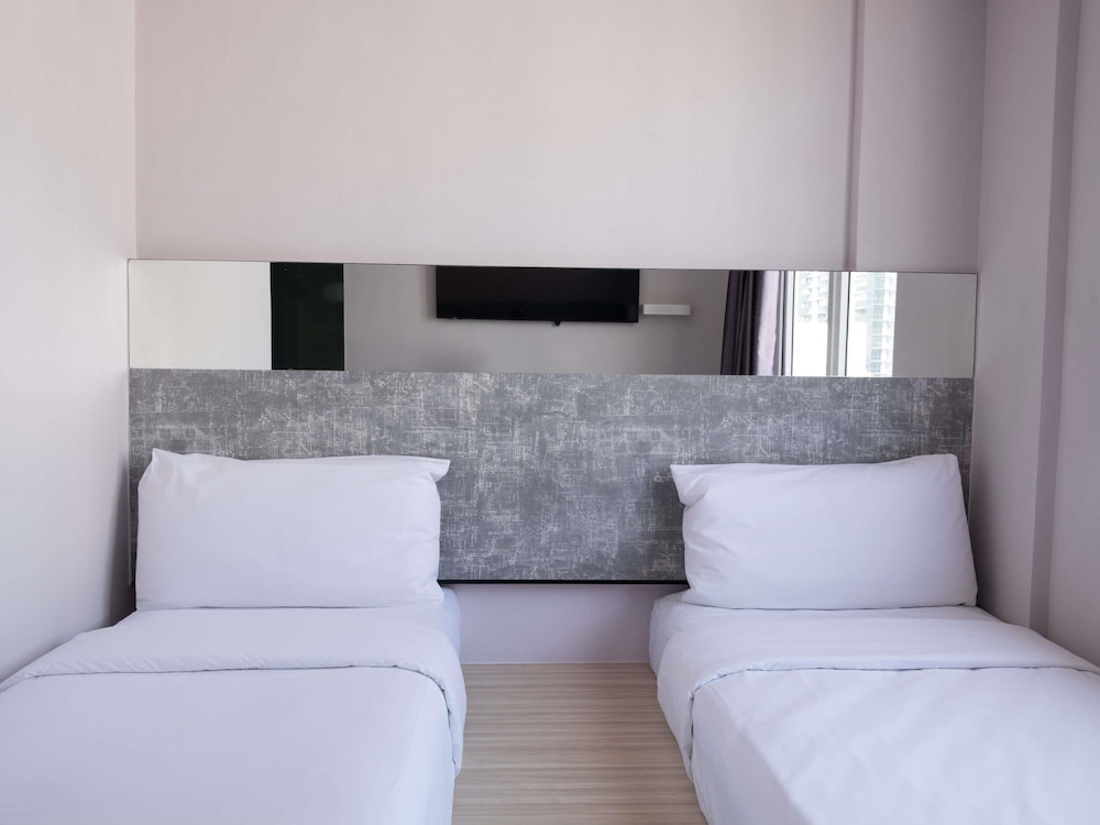 Habitación superior con 2 camas individuales del hotel Ibis Budget Singapore Pearl (sg Clean). Foto 3