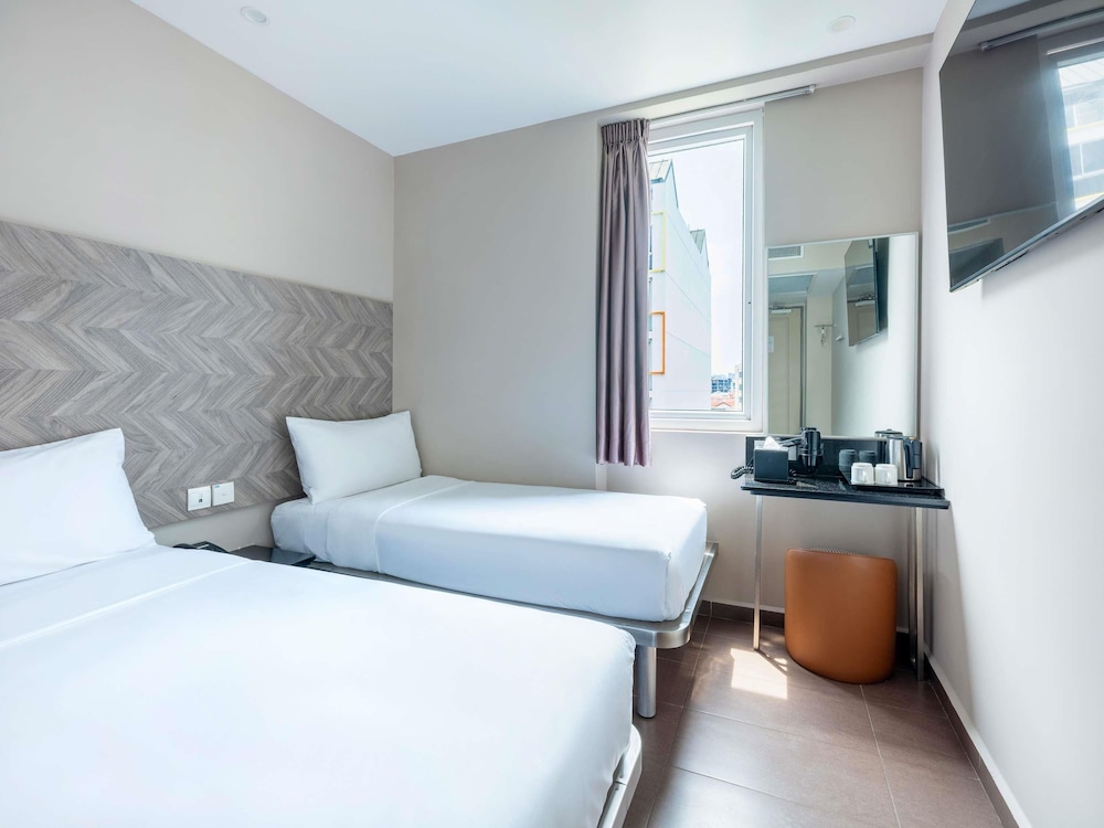 Habitación superior con 2 camas individuales del hotel Ibis Budget Singapore Ruby. Foto 1