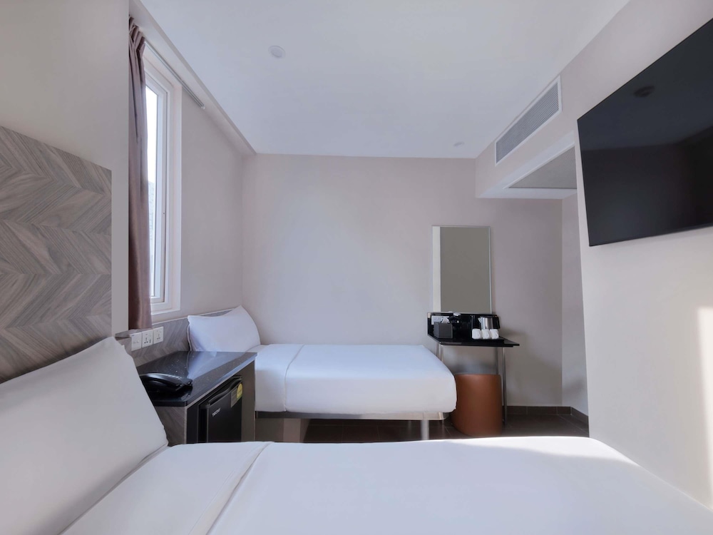 Habitación Superior con 1 cama doble y 1 cama individual del hotel Ibis Budget Singapore Ruby. Foto 3