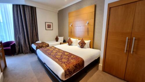Habitación Triple Executive del hotel The Park City Grand Plaza Kensington. Foto 9