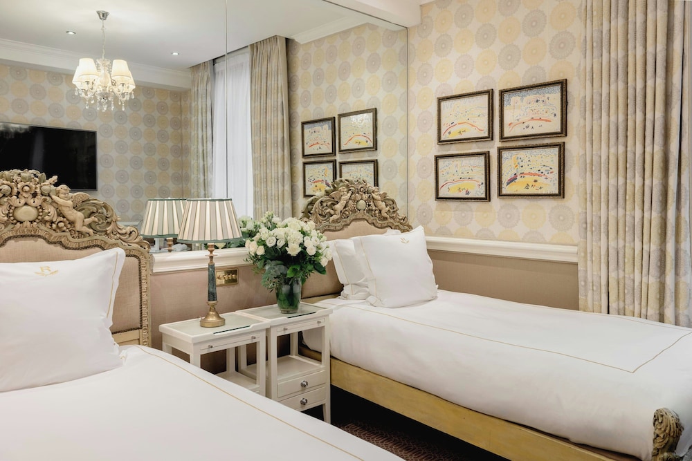 Habitación superior con 2 camas individuales del hotel The Rubens At The Palace