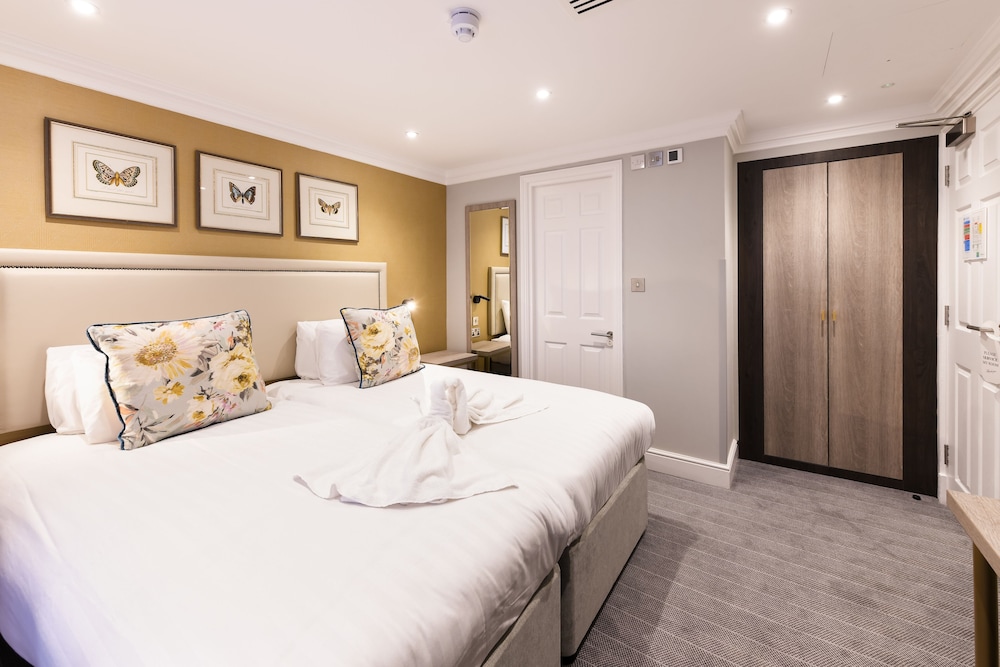 Habitación con 2 camas individuales del hotel Byron London. Foto 2
