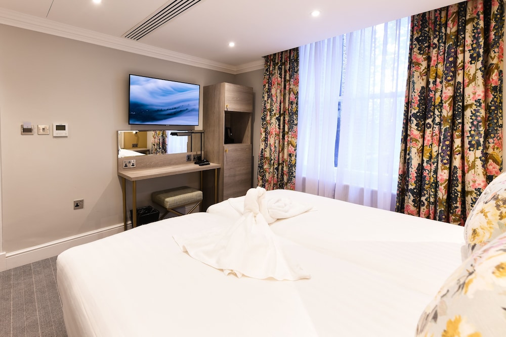 Habitación con 2 camas individuales del hotel Byron London. Foto 3