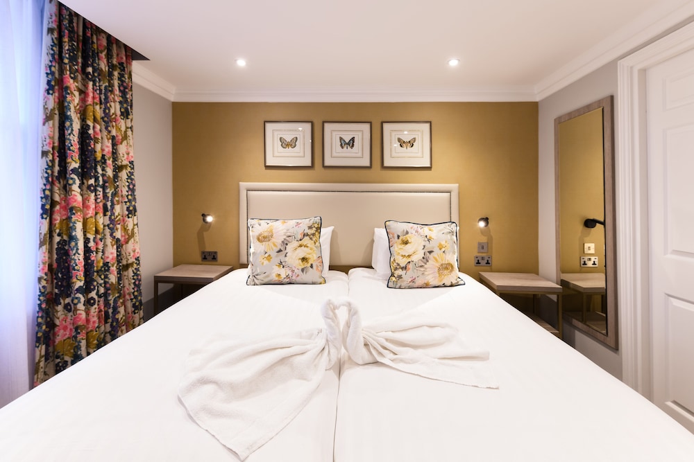 Habitación con 2 camas individuales del hotel Byron London. Foto 4