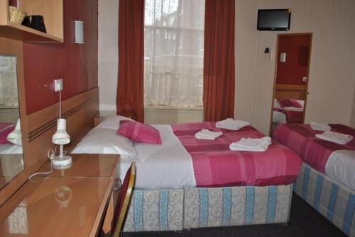 Habitación Triple del hotel Guilford House. Foto 8