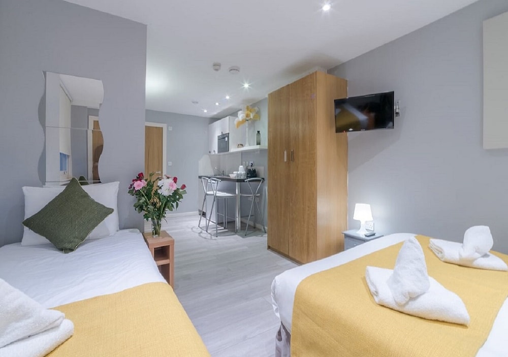 Habitación triple, varias camas del hotel Hyde Park Executive Apartments