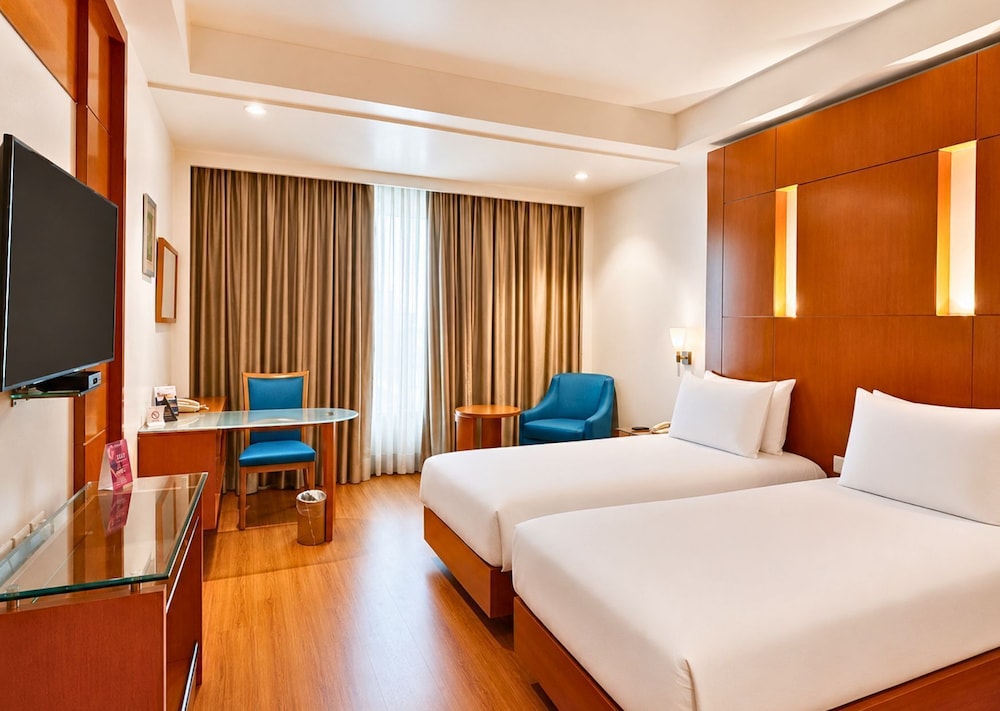 Habitación Deluxe con camas individuales, no fumadores del hotel Ramada By Wyndham Jaipur. Foto 7