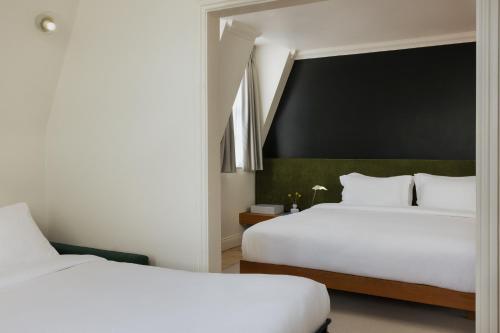 Habitación Triple Deluxe del hotel Numa London Chelsea Green