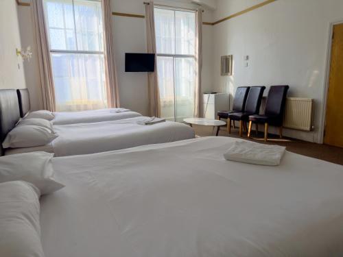 Habitación Familiar Deluxe del hotel OYO Somerset Baker Street London. Foto 9