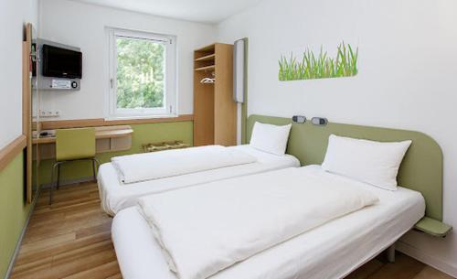 Habitación Doble con dos camas individuales del hotel ibis budget Flensburg Handewitt. Foto 6