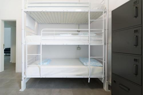Litera en habitación compartida mixta del hotel Las Palmas by YouRoom. Foto 1