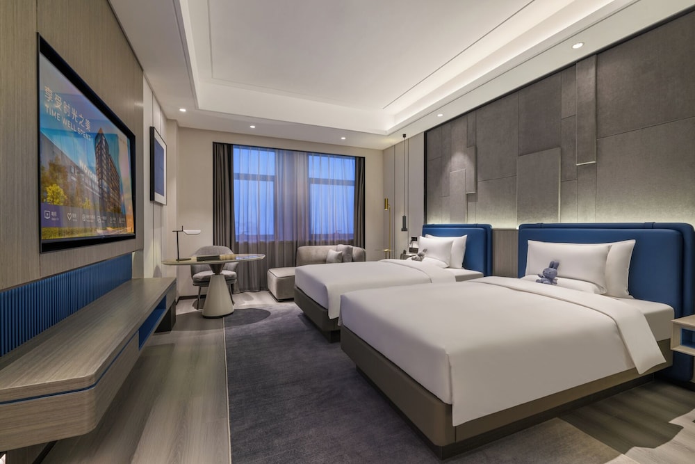 Habitación superior, 2 camas individuales del hotel Novotel Kunshan Yangcheng Lake. Foto 1