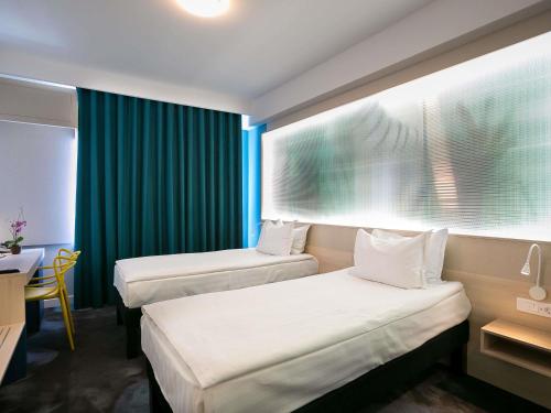 Habitación Doble Estándar - 2 camas del hotel ibis Styles Dunarea Galati. Foto 2
