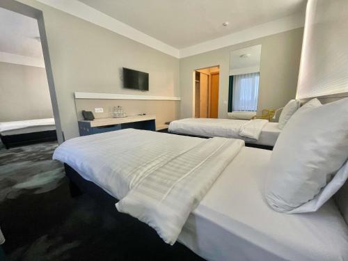Habitación Estándar con 3 camas individuales del hotel ibis Styles Dunarea Galati