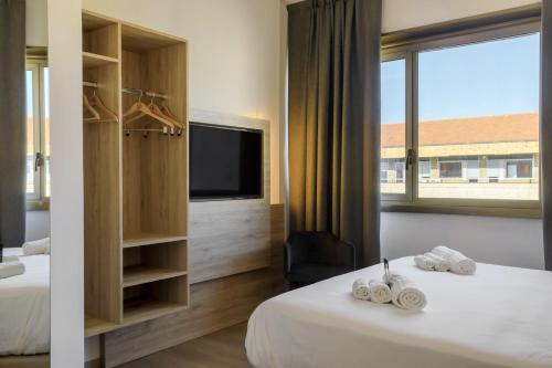Habitación Deluxe con cama Queen del hotel B&B HOTEL Catania City Center. Foto 2