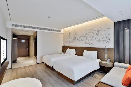 Superior Twin del hotel UrCove by Hyatt Jiashan Centre. Foto 3