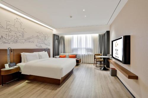 Business Deluxe King del hotel UrCove by Hyatt Jiashan Centre. Foto 1