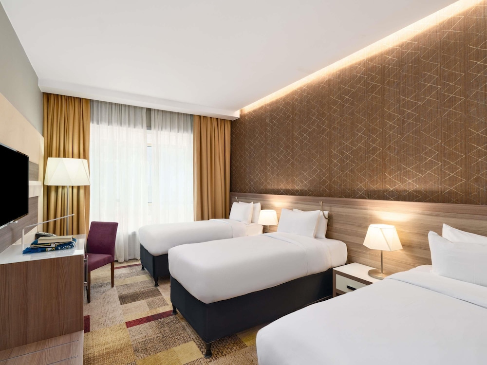 Habitación Classic Triple del hotel Mercure Makkah Aziziah