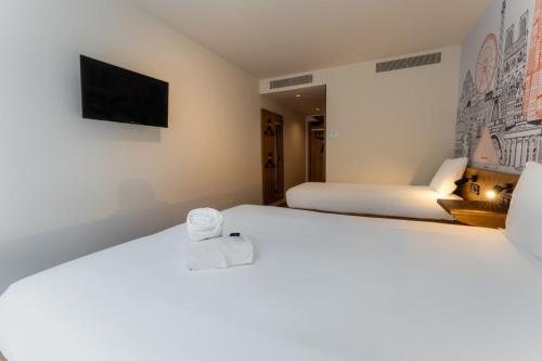 Habitación Triple Estándar del hotel easyHotel Valencia Ciutat Vella. Foto 8