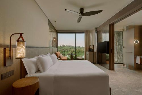 Alojamiento Sanctuary con cama extragrande del hotel Mandai Rainforest Resort By Banyan Tree. Foto 1