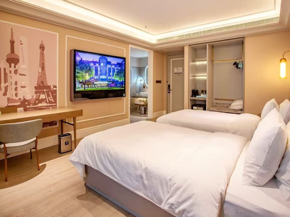 HABITACIÓN DELUXE, Dos Camas Gemelas del hotel Mercure Shanghai Waigaoq Free Trade Zone. Foto 2