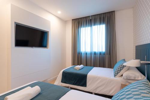 Suite Familiar con balcón del hotel Beach Alfredo. Foto 18