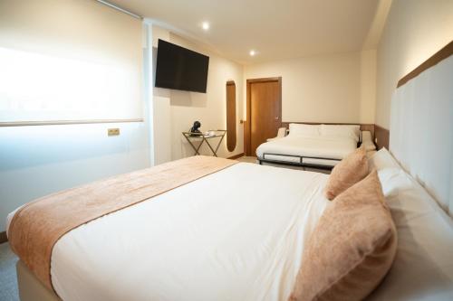 Habitación Triple del hotel Hospedium A Mar. Foto 16