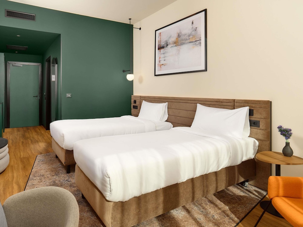 Habitación estándar con dos camas individuales del hotel Novotel Zagreb. Foto 2