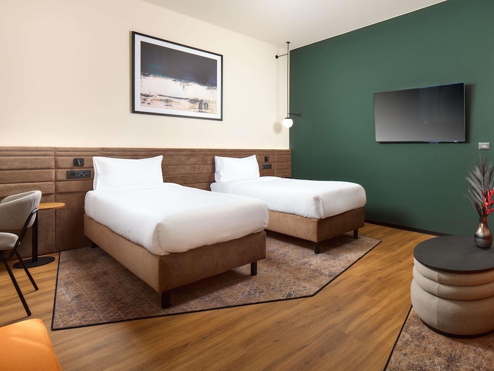 Habitación estándar con dos camas individuales del hotel Novotel Zagreb. Foto 4